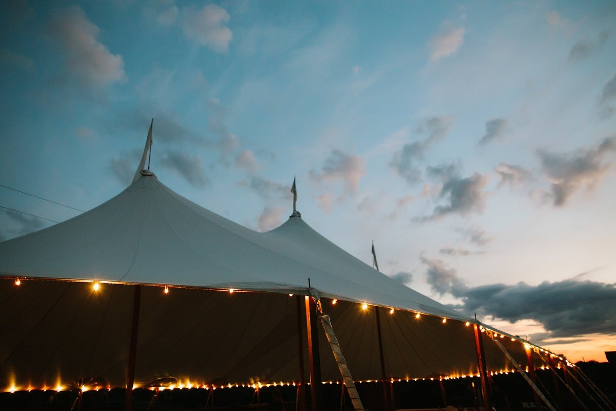 Evening photo of the tent and string lights at Misty Farm